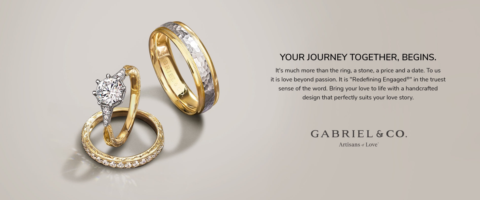 An engagement ring, a mens wedding band, and a womens wedding band on a beige background from Gabriel & Co, an American jeweller from New York.