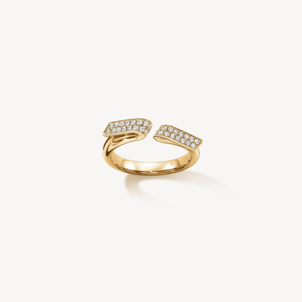 A yellow gold ring with diamonds from designer Hearts on Fire.