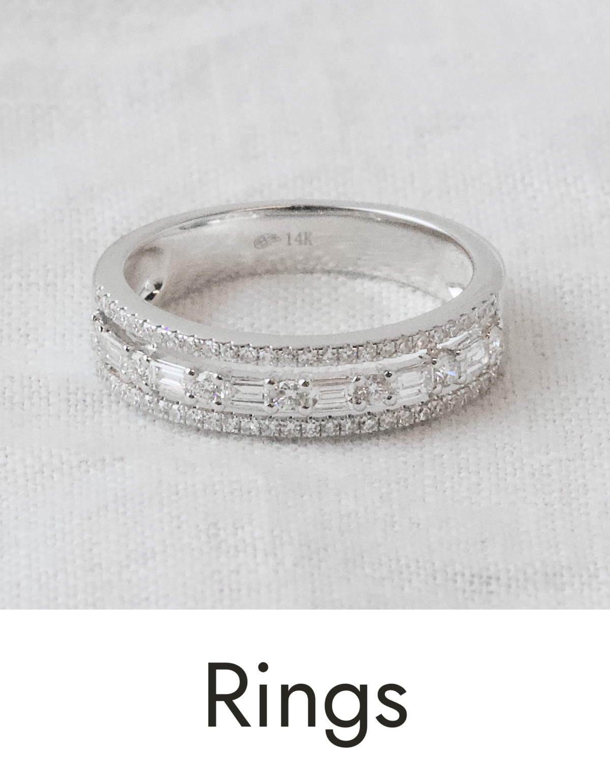 A white gold ring set with multiple diamond shapes, linked to the fashion rings collection.