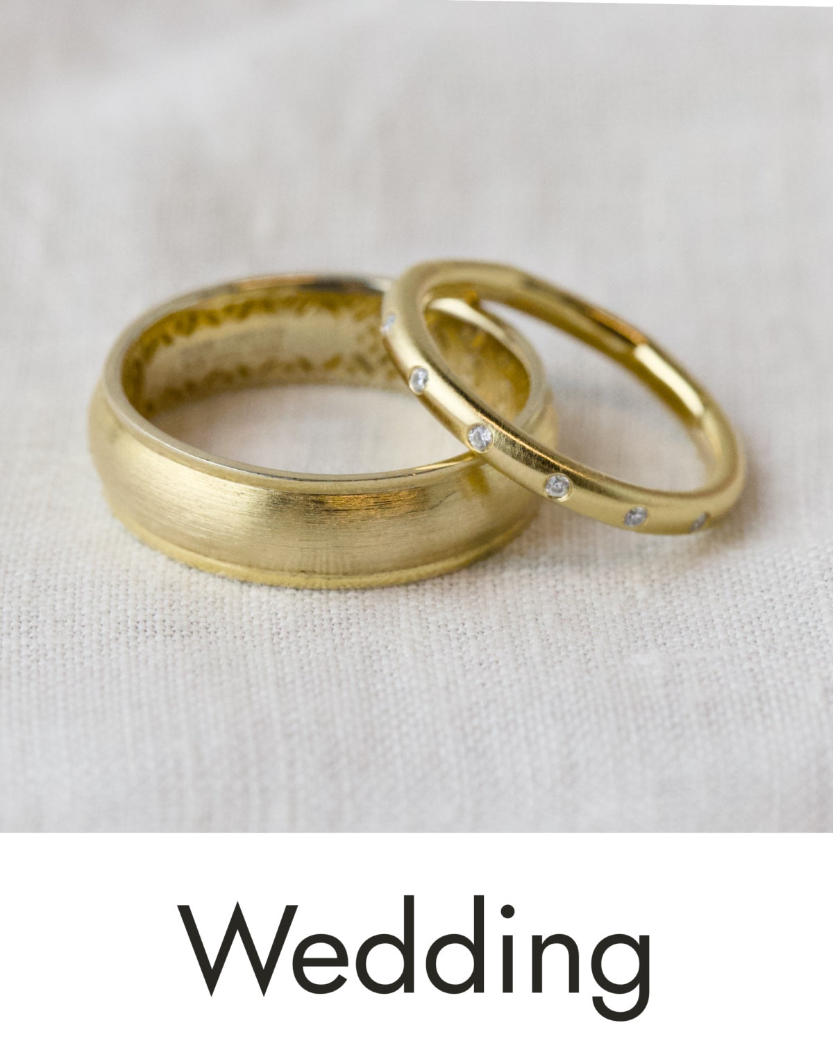 Two yellow gold wedding bands, linked to the womens wedding band collection.