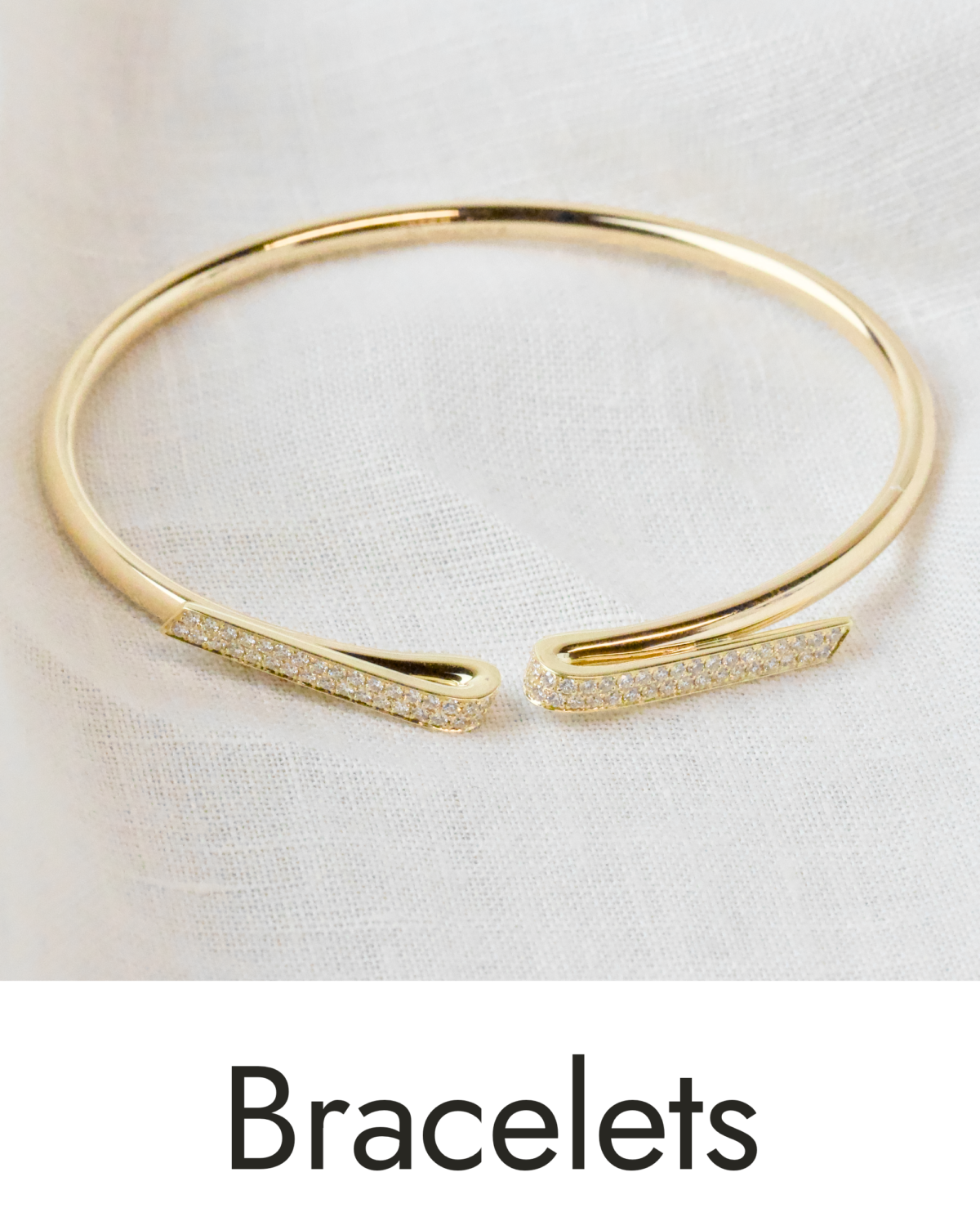 A yellow gold bangle bracelet, linked to the bracelet collection.