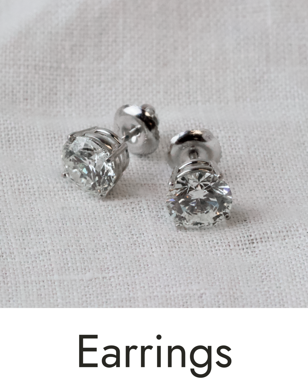 A pair of white gold earrings, linked to the earrings collection.